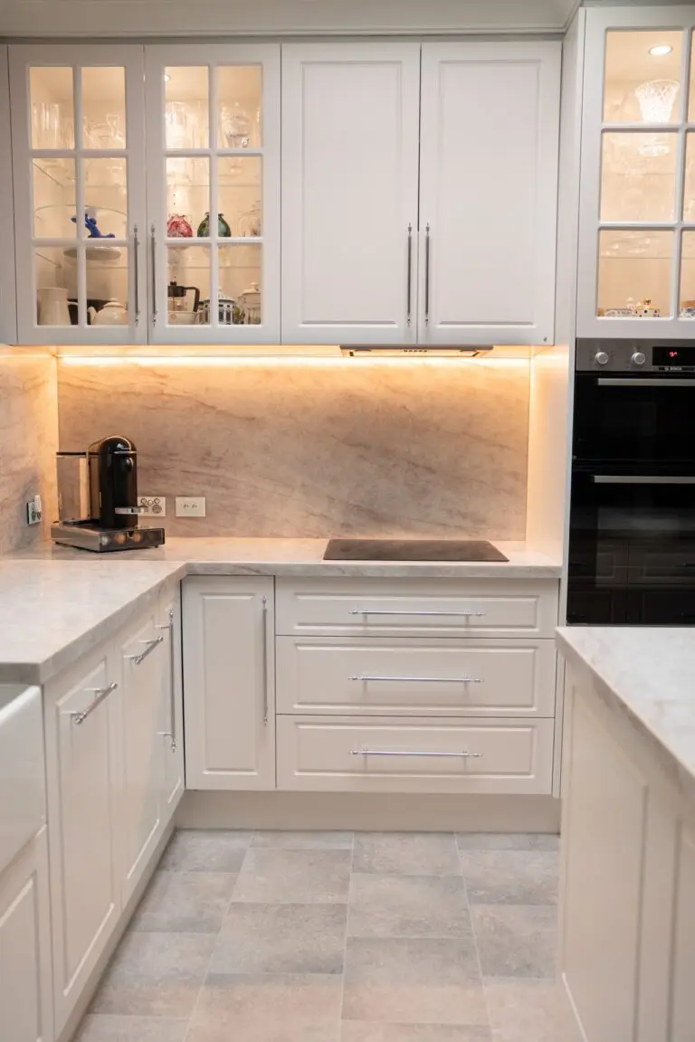 Classic cream shaker cabinetry with glazed upper display cabinets