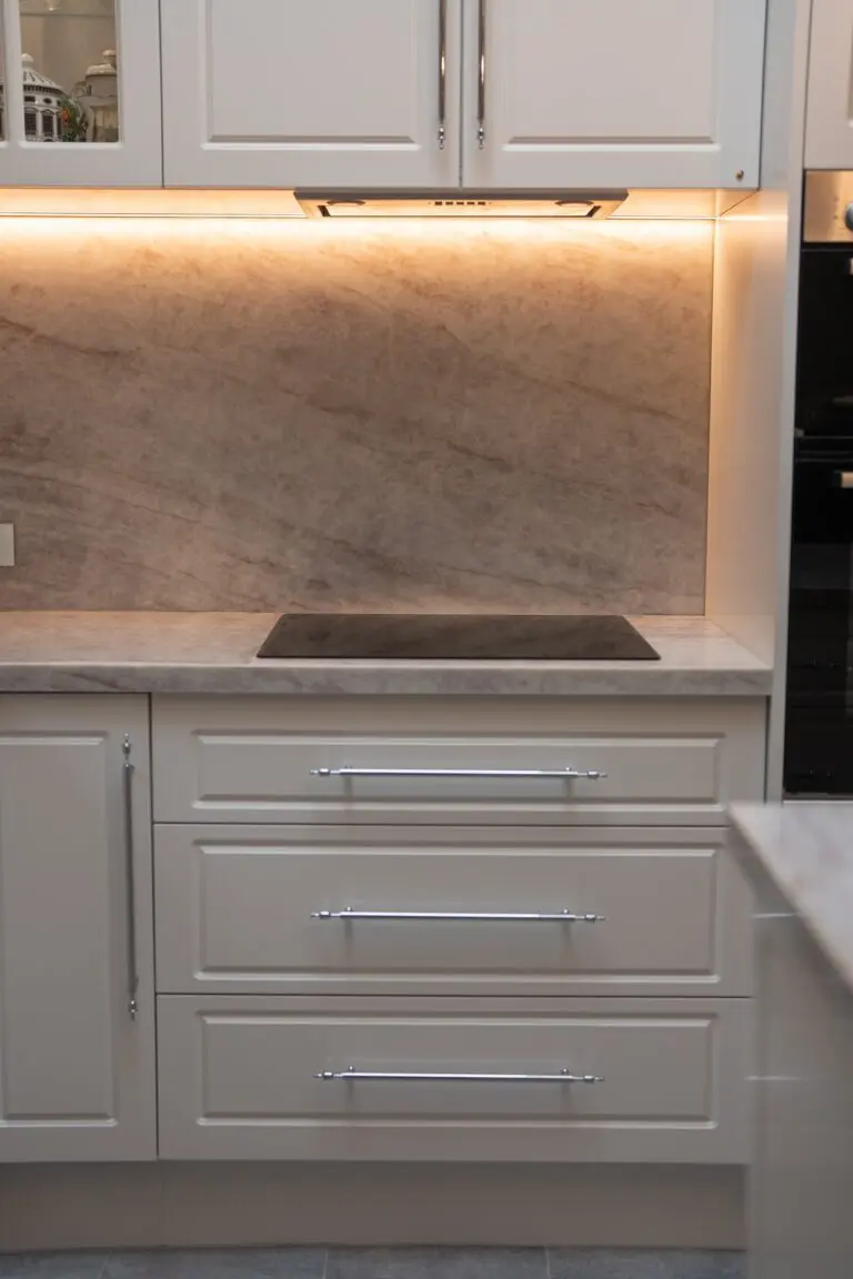 An induction cooktop set into a marble benchtop